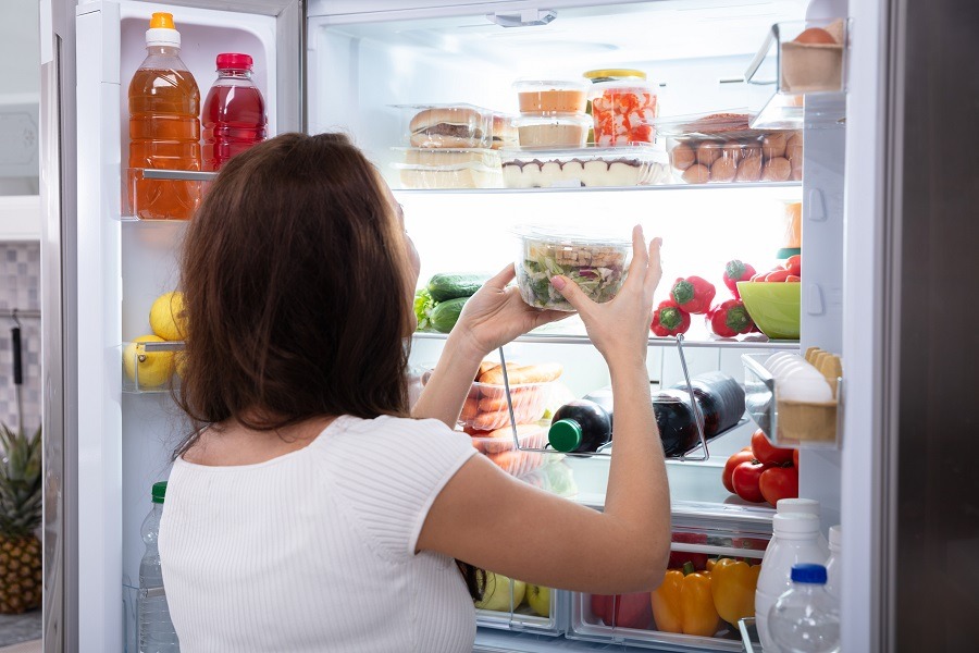 Woman Taking Food From Refrigerator