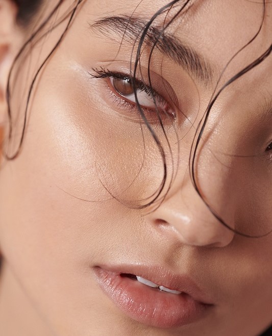 dewy and highlighted makeup closeup