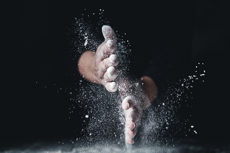 hands playing with flour 