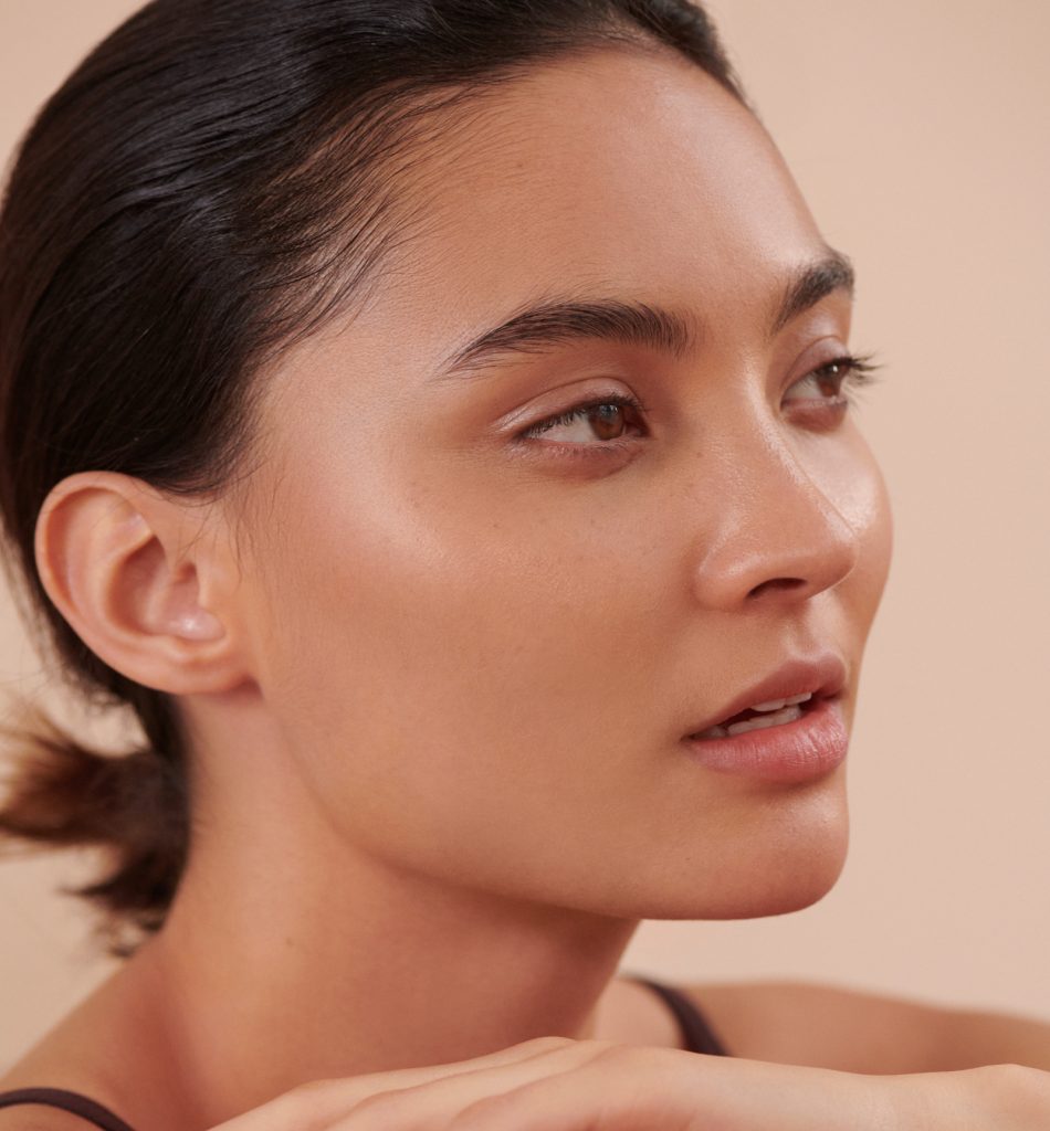 model wearing subtle foundation with smooth complexion