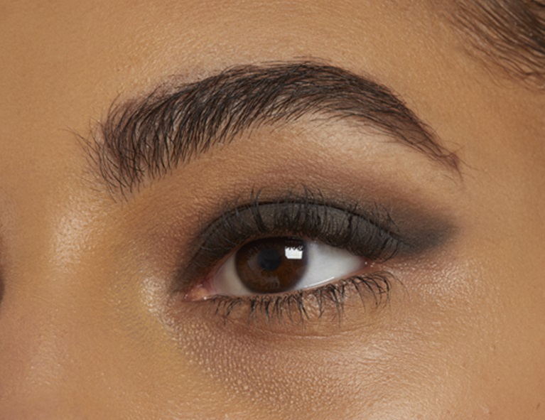 close up shot of black and brown smudged eyeliner